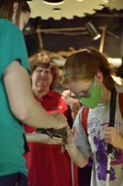 Lindy petting a turtle during SEE camp
