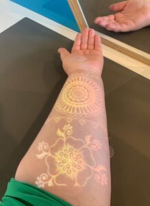 projection of a henna design on my arm