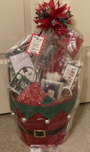 Holly Jolly Gift Basket with red and green household items and treats