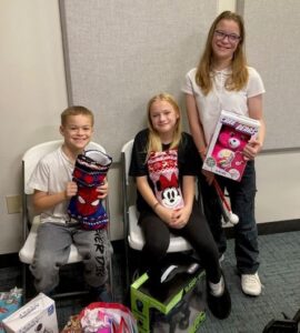 molly and siblings receiving their gifts