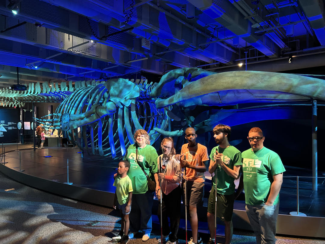 Everyone standing in front of the Blue Whale Skeleton.