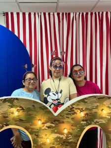 Three Winston-Salem employees celebrate the 90th anniversary at the cookie bar.