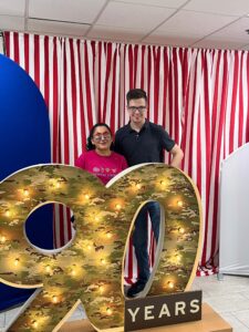 Two Winston-Salem employees celebrate the 90th anniversary at the cookie bar.