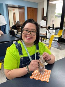 A Winston-Salem facility employee enjoys ice cream at the 90th anniversary ice cream event.