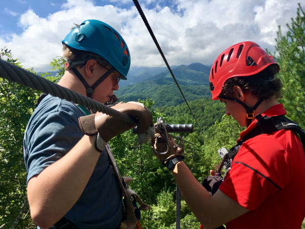 SEE Camper Ben prepares to ride a massive zipline over the tops of trees at the 2017 SEE Adventure Camp.