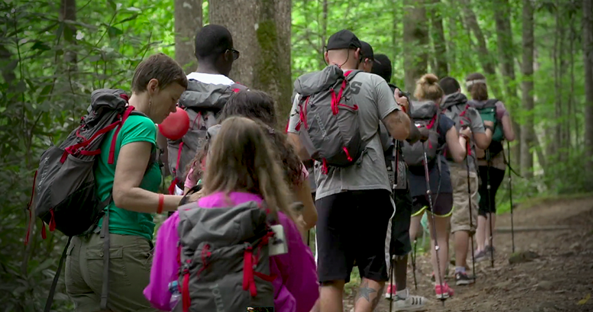 Kids who are blind hike through the woods