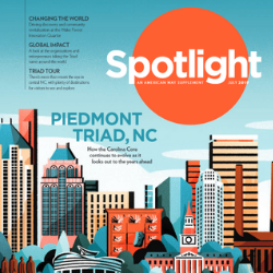 Cover image of Spotlight Magazine depicts downtown Greensboro skyline