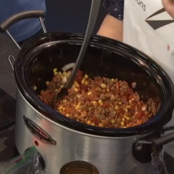 A crock pot is full of ingredients to make Taco Soup