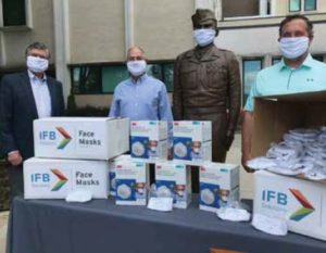 Randy Buckner, IFB Asheville Director of Operations, and Fred Groce, Asheville Advisory Board Chair, presenting masks to Craig Doane, the Charles George VA Medical Center Chief of Voluntary Service.