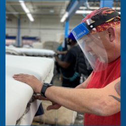 Image of IFB employee inspecting a mattress