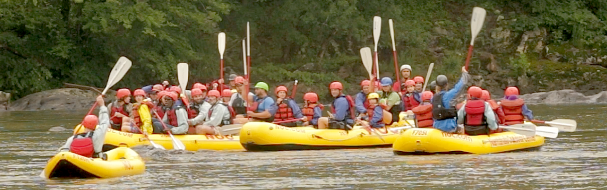 SEE camp rafters give the "Paddles Up" signal