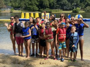 Group photo of SEE campers during water activities 
