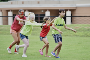 S.E.E. Campers holding onto one another during relay race.