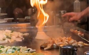 flaming onion tower on hibachi grill