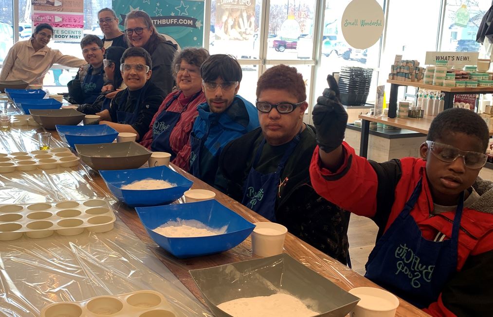SEE students and volunteers making shower steamers at Buff City Soap