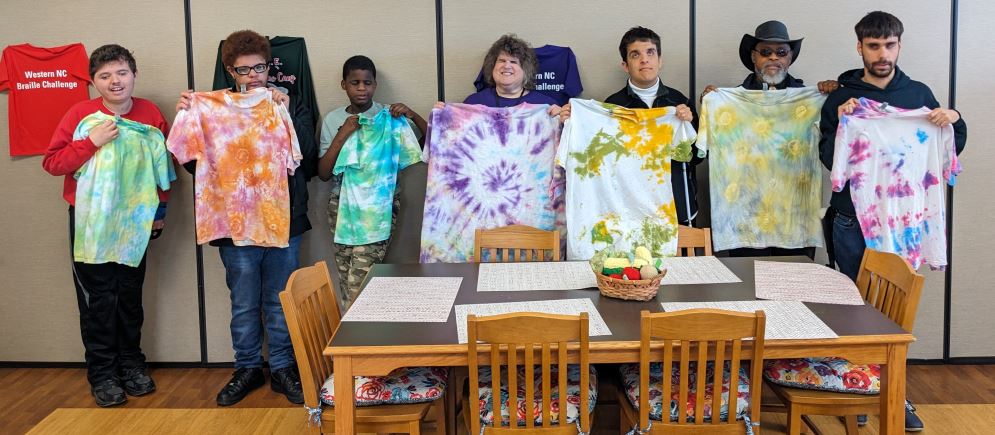 S.E.E. students and staff show off their tie-dyed t-shirts
