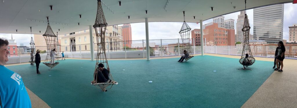 S.E.E. kids on rooftop swings