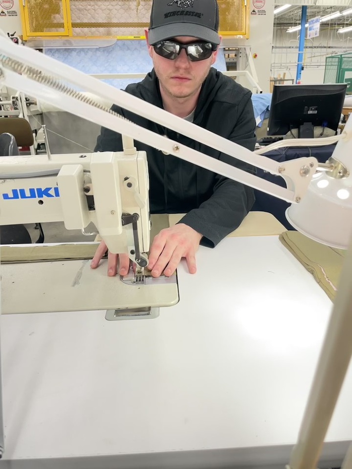 Tim Jones uses an adapted single-needle machine for making collars.