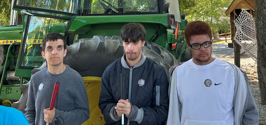 S.E.E. students pose in front of the tractor