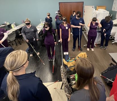 Learning About Blindness - students wear blindfolds and learn mobility with canes