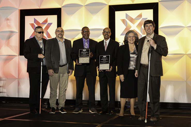 Our Department of Energy Base Supply Center receiving recognition for outstanding performance at the National Industries for the Blind Conference.