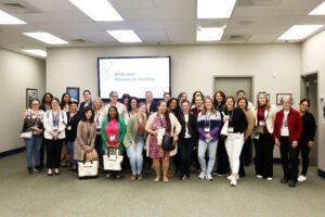 The April, 2026 Women in Textiles group gathers for a group photo after touring the Asheville facility manufacturing floor.