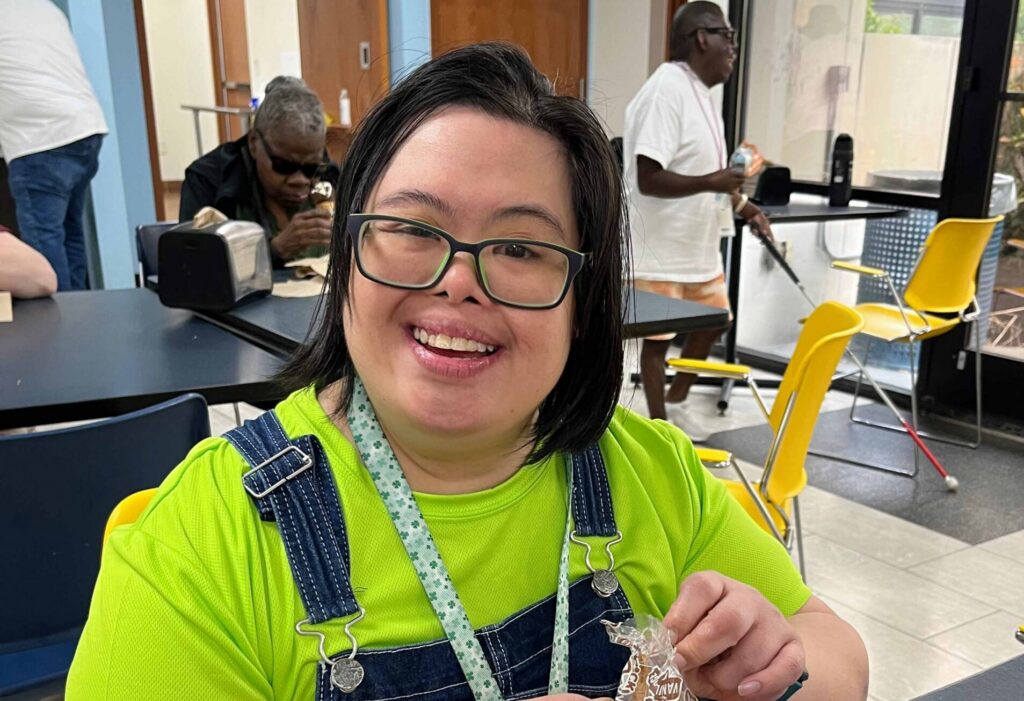 A Winston-Salem facility employee smiles for the camera.